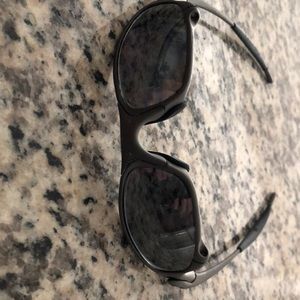 One lot of 2 pair, Oakley Romeo, and Oakley “Juliet” Metal frames, black iridium